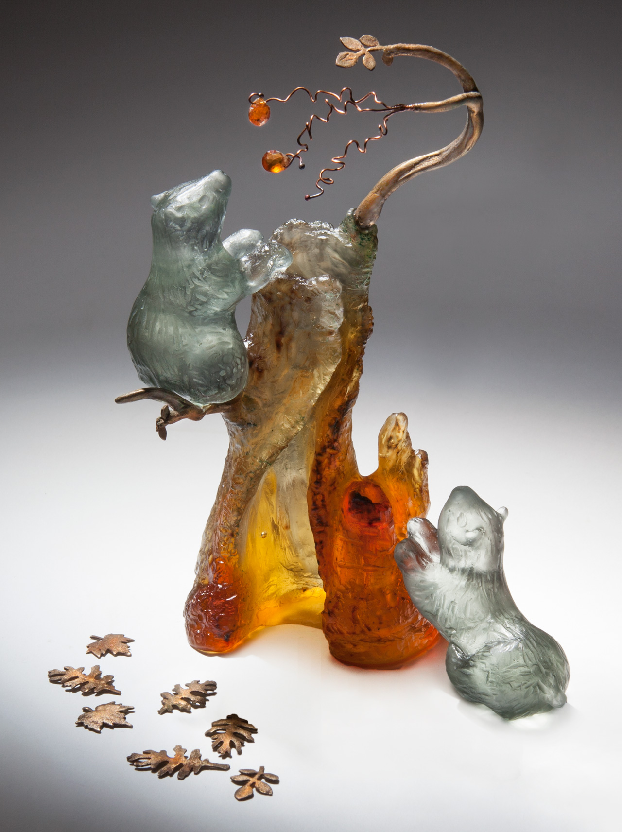 glass sculpture: bears climbing tree for fruit